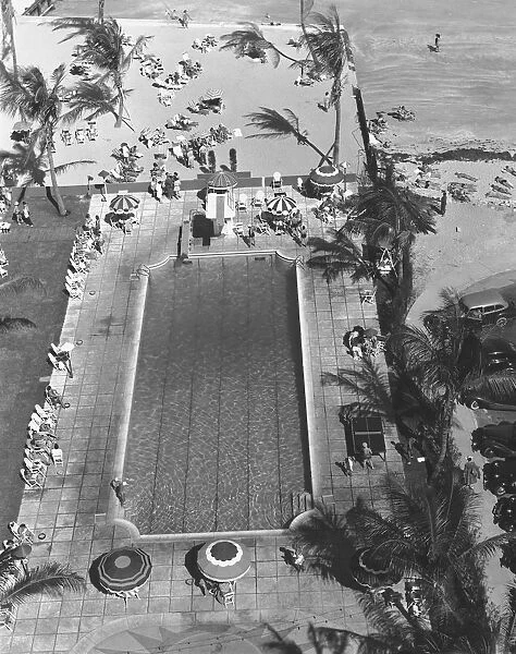 Swimming pool at seashore, (B&W), elevated view