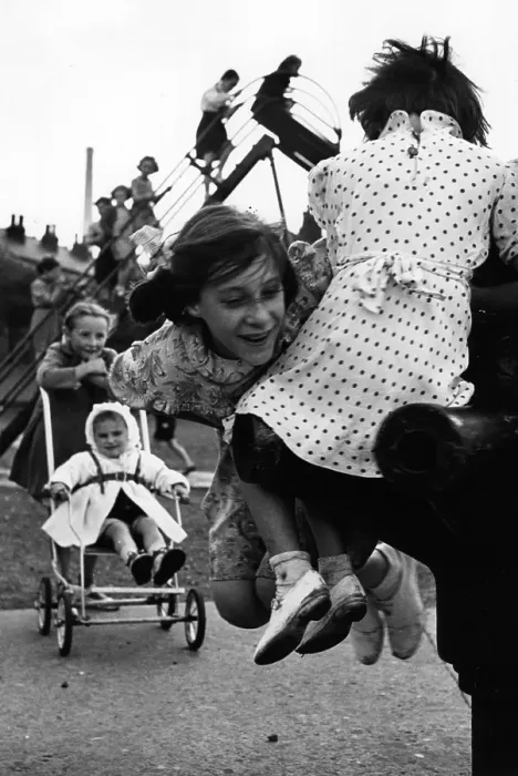 Framed Print : Swings. 1950: Children playing happily in their playground during a break