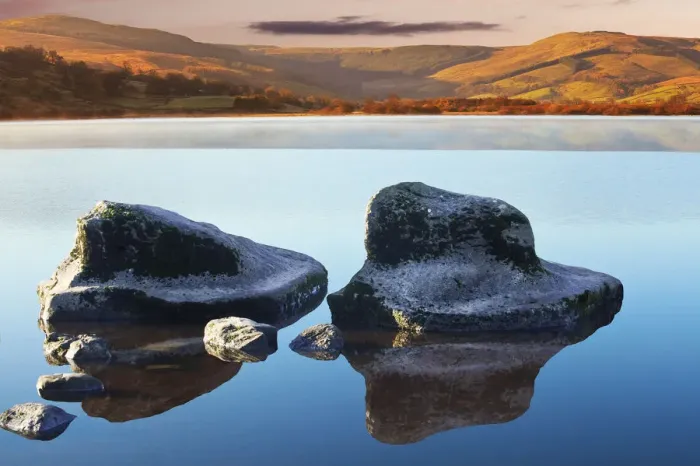 Framed Print : Symbols. Semer water of Yorkshire Dales with water rocks and reflections on it