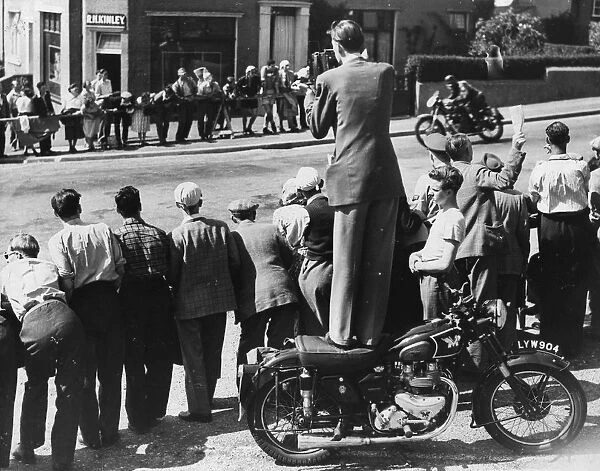 T T Photographer. 9th June 1951: Don Price taking photos