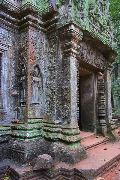 Ta Prohm bas reliefs on temple doorway, Angkor, Cambodia