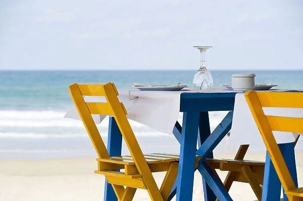 Table and chairs on the beach of Conil de la Frontera, Costa de la Luz, Andalusia, Spain, Europe