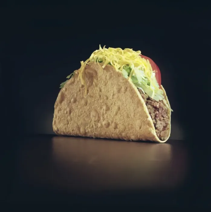 Framed Print : A Taco. View of a meat taco with lettuce and tomatos on a black background, January 1989 Framed Print : A Taco. View of a meat taco with lettuce and tomatos on a black background, January 1989
