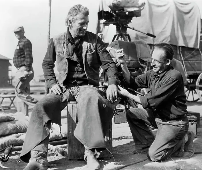 Framed Print : Tailor on Set Mending John Wayne's Shirt Framed Print : Tailor on Set Mending John Wayne's Shirt