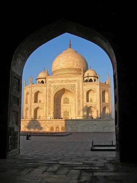 Taj Mahal. The Taj Mahal in early morning light seen through the doorway