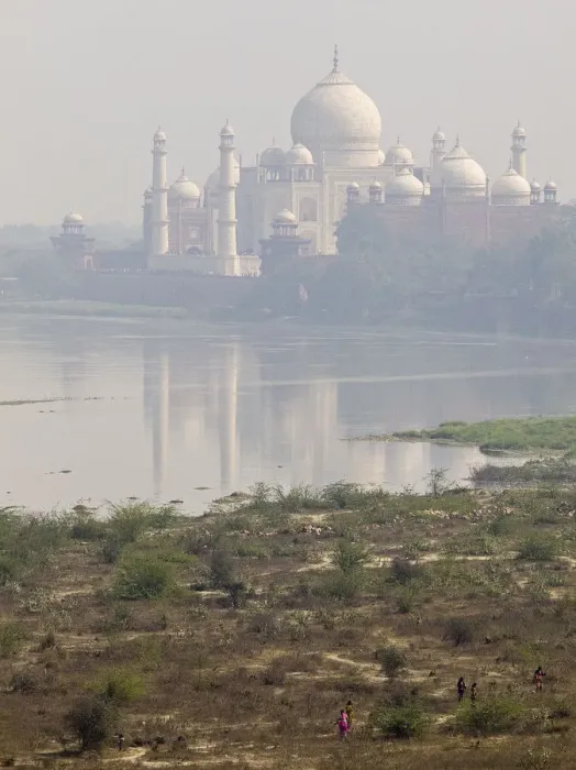 Framed Print : Taj Mahal. A view of Taj Mahal from Yamuna river where some people are walking Framed Print : Taj Mahal. A view of Taj Mahal from Yamuna river where some people are walking
