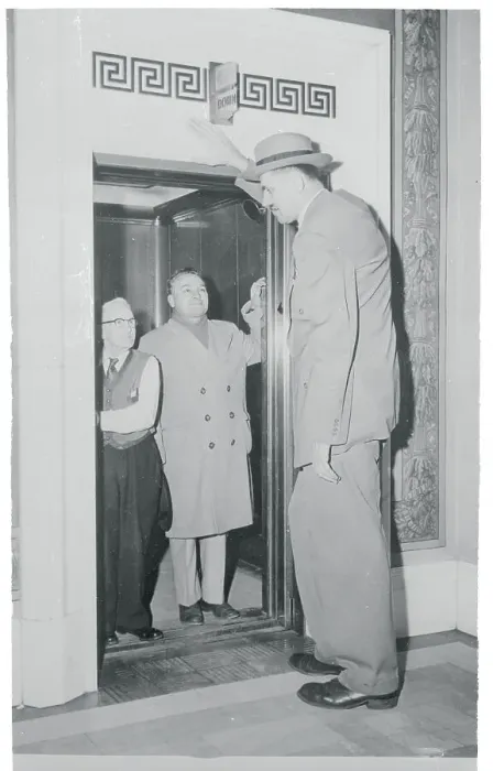 Framed Print : Tallest Man Entering Elevator Framed Print : Tallest Man Entering Elevator