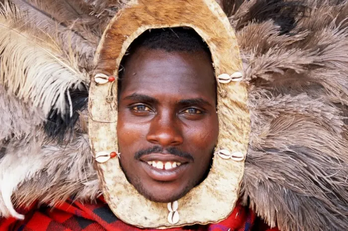 Framed Print : Tanzania, Oloirobi Village, Msai moran (young warrior) in ostrich he Framed Print : Tanzania, Oloirobi Village, Msai moran (young warrior) in ostrich he