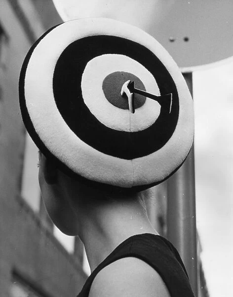 On Target. 18th July 1966: A beret by Simone Mirman is modelled by Caroline