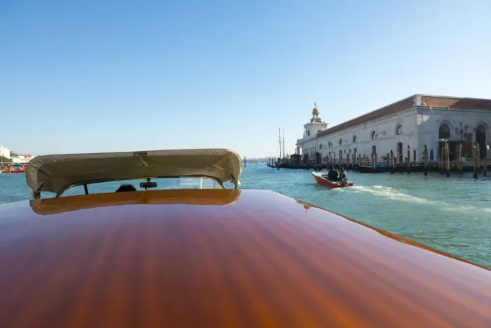 Framed Print : Taxi boat on Grand Canal and old customs building in Venice, Italy Framed Print : Taxi boat on Grand Canal and old customs building in Venice, Italy