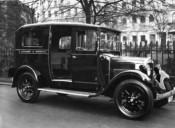 Taxi Cab. circa 1930: A shiny black taxi cab waiting for a fare