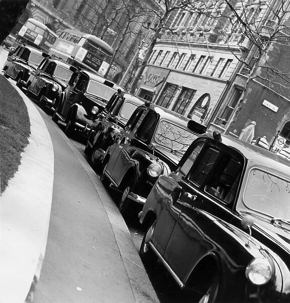 Taxi Rank. June 1966: A taxi cab rank outside the Law Courts in The Strand, London