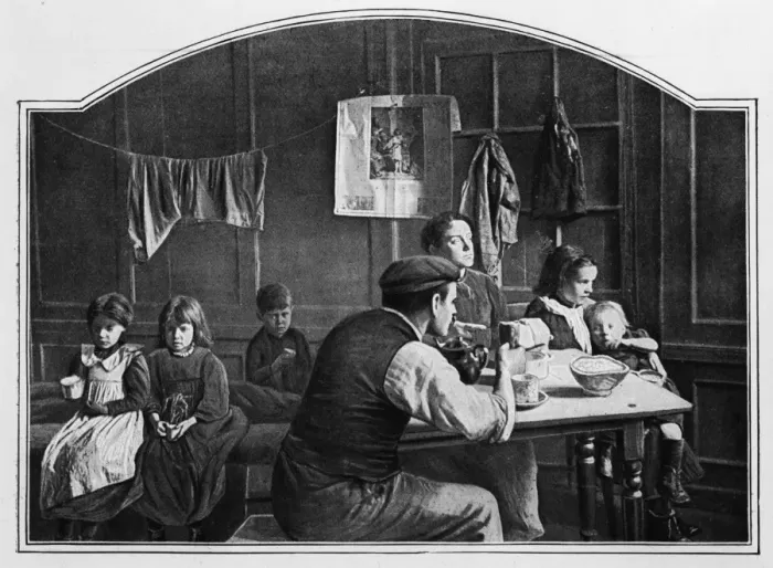 Framed Print : Tea Time. circa 1901: A working family having their tea in a London slum