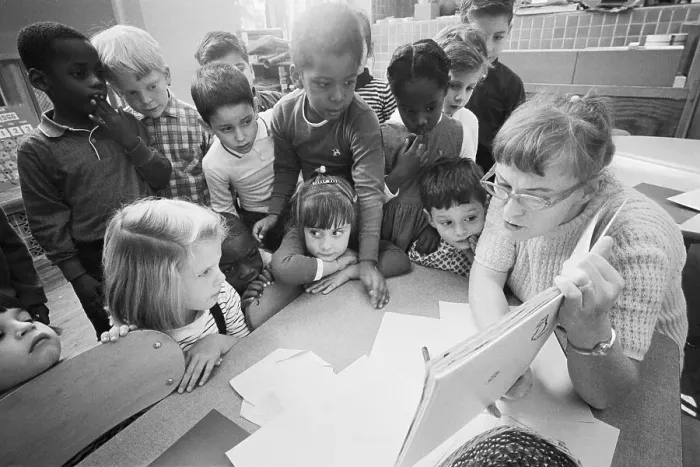 Framed Print : Teacher Reads to Students in Integrated Classroom Framed Print : Teacher Reads to Students in Integrated Classroom