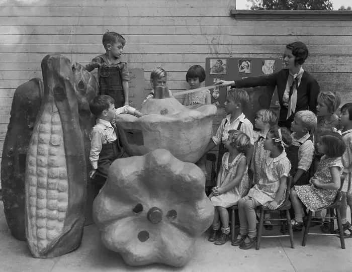 Framed Print : Teacher Using Large Food Models in Classroom Framed Print : Teacher Using Large Food Models in Classroom