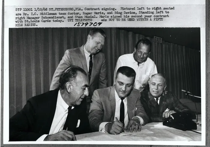 Framed Print : Team players Signing Contract Framed Print : Team players Signing Contract