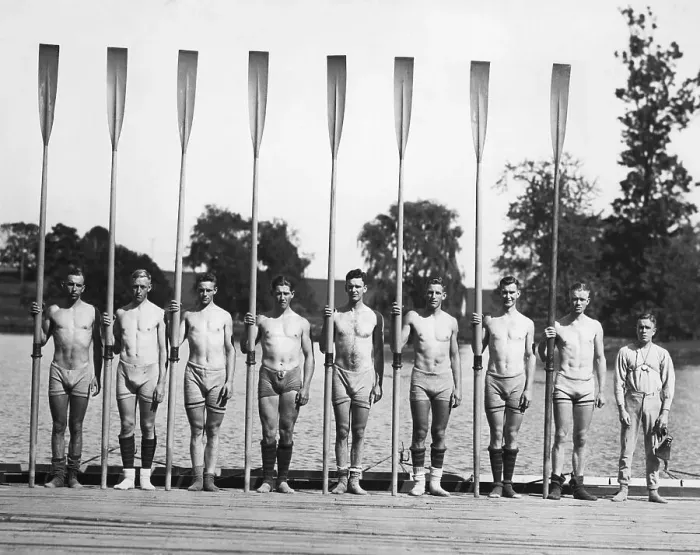 Framed Print : Teammates Posing With Oars On Dock