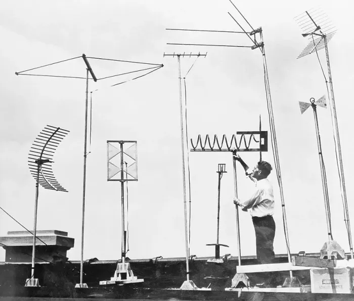Framed Print : Technician Adjusting Television Antennae on Roof Framed Print : Technician Adjusting Television Antennae on Roof