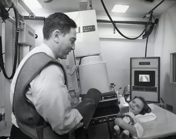 Framed Print : Technician Setting X-Ray Up For Girl Framed Print : Technician Setting X-Ray Up For Girl