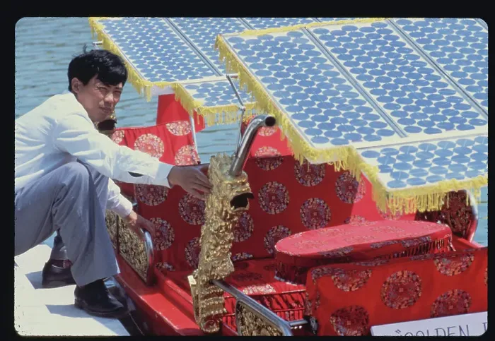 Framed Print : Technician with Solar Powered Boat Framed Print : Technician with Solar Powered Boat