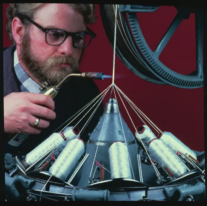 Framed Print : Technologist Applying Flame to Fibers Framed Print : Technologist Applying Flame to Fibers