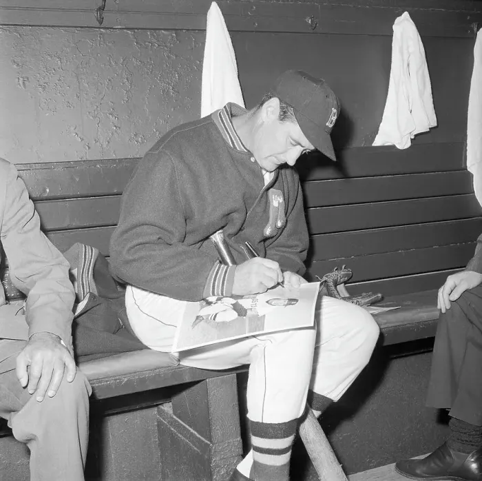 Framed Print : Ted Williams Sitting in Dugout and Signing for Fans Framed Print : Ted Williams Sitting in Dugout and Signing for Fans