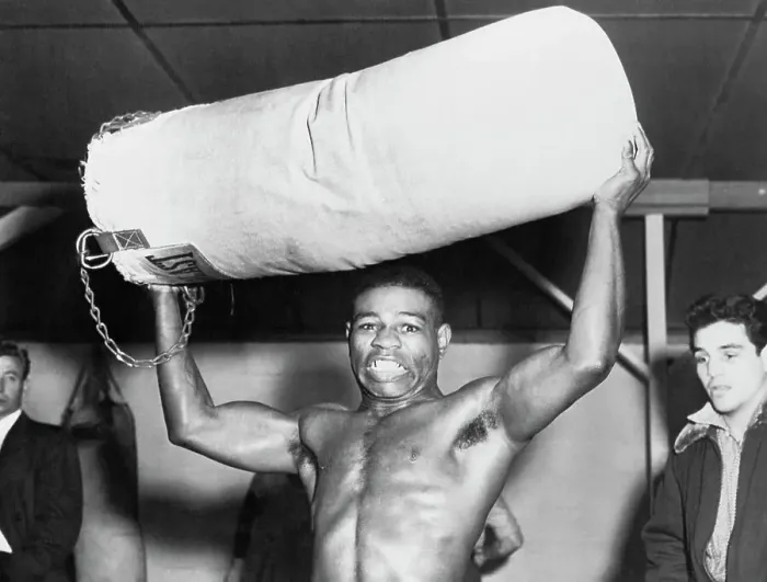 Framed Print : Teddy Davis Holding a Punching Bag Framed Print : Teddy Davis Holding a Punching Bag