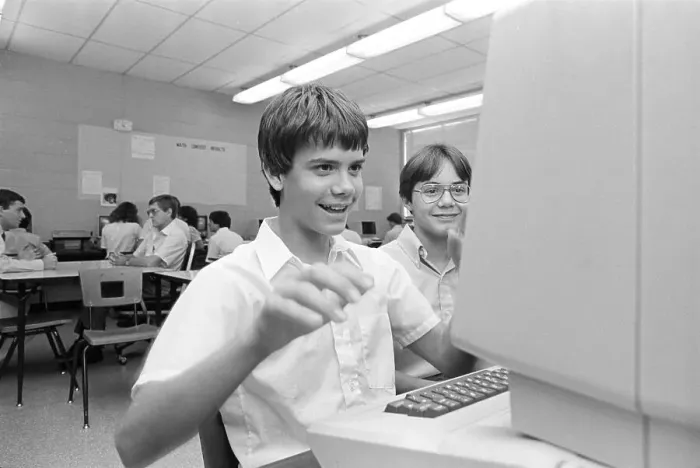 Framed Print : Teen Playing German Language Game on School Computer Framed Print : Teen Playing German Language Game on School Computer
