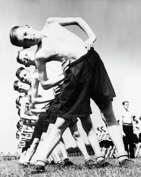 Framed Print : Teenage Boys Stretching on Field Framed Print : Teenage Boys Stretching on Field
