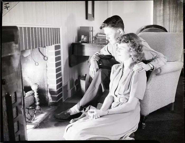 Framed Print : Teenage Couple Sitting Near Fireplace Framed Print : Teenage Couple Sitting Near Fireplace