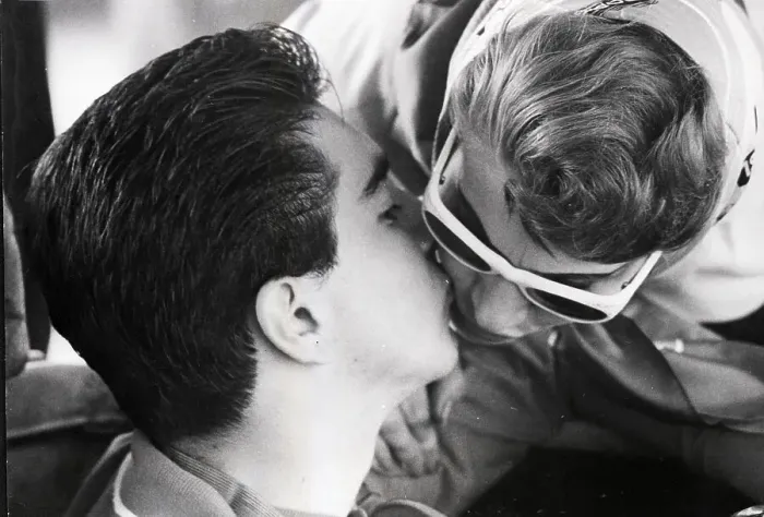 Framed Print : Teenage Race Driver Kisses Mother