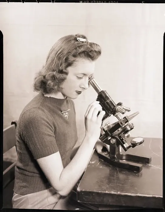 Framed Print : Teenager Looking Through Microscope Framed Print : Teenager Looking Through Microscope