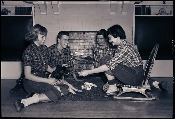 Framed Print : Teenagers Toast Marshmallows by Fireplace Framed Print : Teenagers Toast Marshmallows by Fireplace