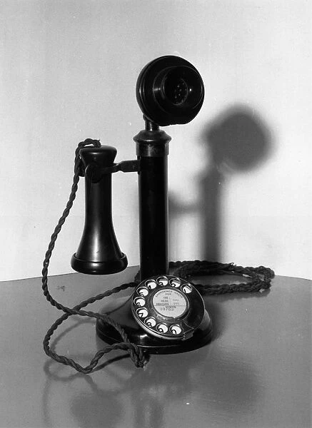 Telephone. circa 1920: An old-fashioned candlestick telephone