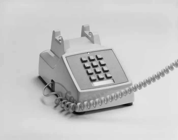 Framed Print : Telephone on white background, close-up Framed Print : Telephone on white background, close-up