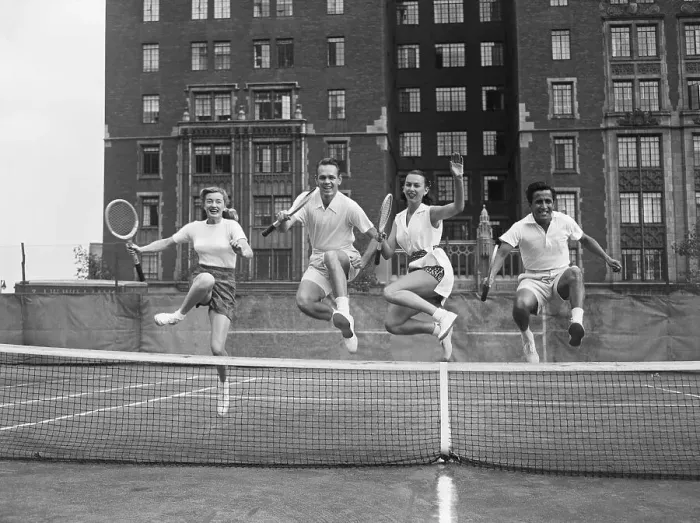 Framed Print : Tennis Players Jumping Over Net Framed Print : Tennis Players Jumping Over Net