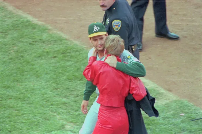 Framed Print : Terry Steinbach Embracing His Wife on Field Framed Print : Terry Steinbach Embracing His Wife on Field