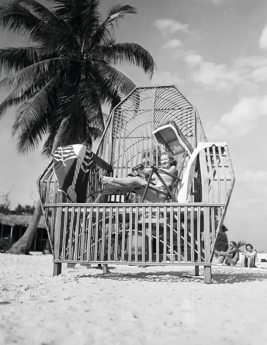 Framed Print : Tez Jackson Sitting in a Large Reed Chair
