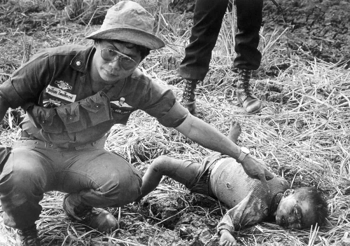 Framed Print : Thai Officer Pointing to Deceased Child Framed Print : Thai Officer Pointing to Deceased Child
