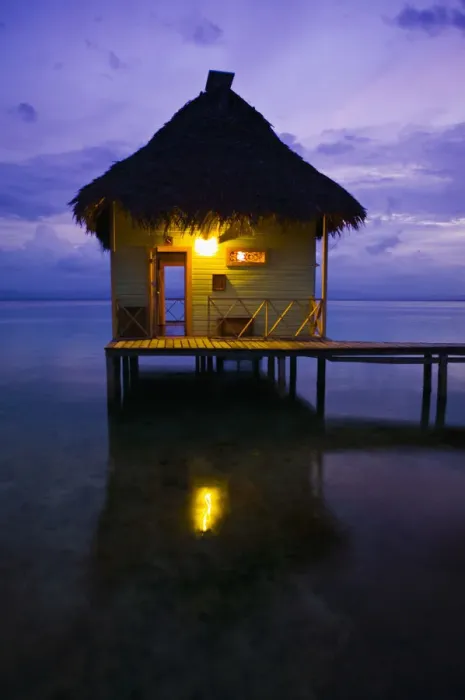 Framed Print : Thatch roofed hut at end of dock, dusk Framed Print : Thatch roofed hut at end of dock, dusk