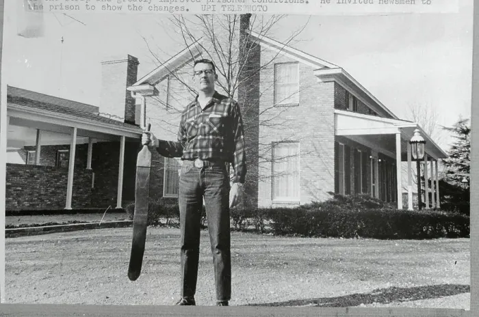 Framed Print : Thomas C. Murton Holding a Strap Outside his Home Framed Print : Thomas C. Murton Holding a Strap Outside his Home