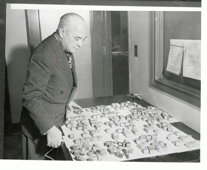 Framed Print : Thomas J. Callaghan Standing over Stamp Collection