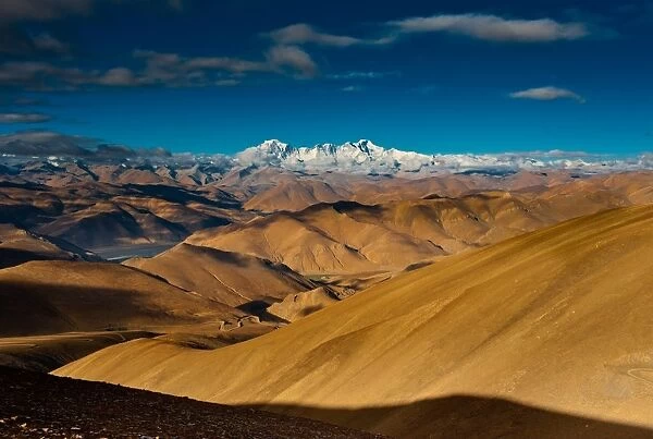 Tibet hilly landscape with himalayas range