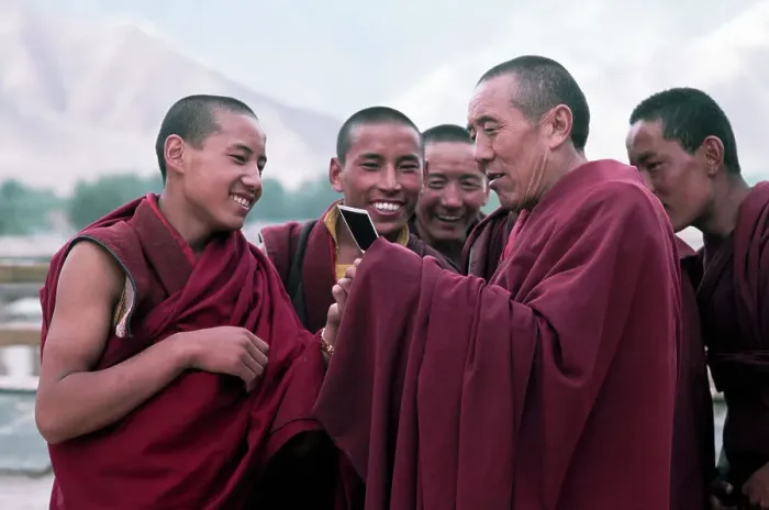 Framed Print : Tibetan Monks Looking At Polaroids Framed Print : Tibetan Monks Looking At Polaroids