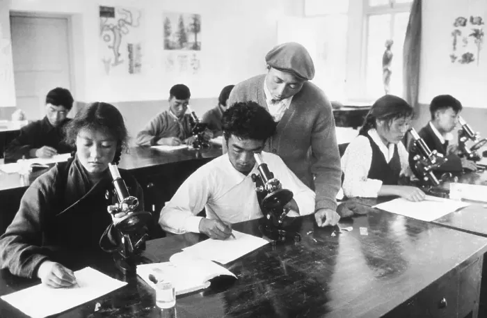 Framed Print : Tibetan Teacher with Students Performing Experiments Framed Print : Tibetan Teacher with Students Performing Experiments