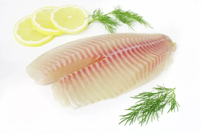 Framed Print : Tilapia fillets on plate with lemon and dill Framed Print : Tilapia fillets on plate with lemon and dill