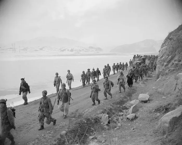 Framed Print : Tired Troops Walk Road Towards Rest Stop