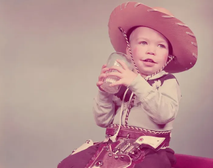 Framed Print : Toddler boy dressed as cowboy, drinking glass of milk. (Photo by H Framed Print : Toddler boy dressed as cowboy, drinking glass of milk. (Photo by H
