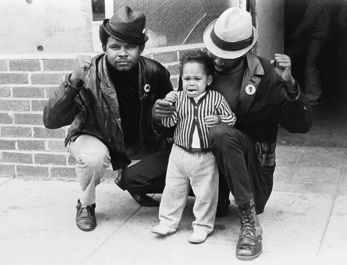 Framed Print : Toddler and Men Giving Black Panther Salute Framed Print : Toddler and Men Giving Black Panther Salute