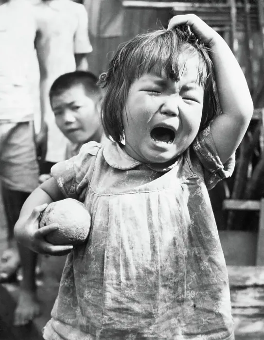 Framed Print : Toddler with Orange Crying Framed Print : Toddler with Orange Crying